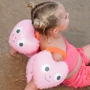Sunnylife-Poppy-The-Peach-Inflatable-Arm-Bands-Pink-Lifestyle-2.webp
