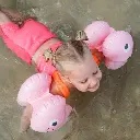 Sunnylife-Poppy-The-Peach-Inflatable-Arm-Bands-Pink-Lifestyle-3.webp
