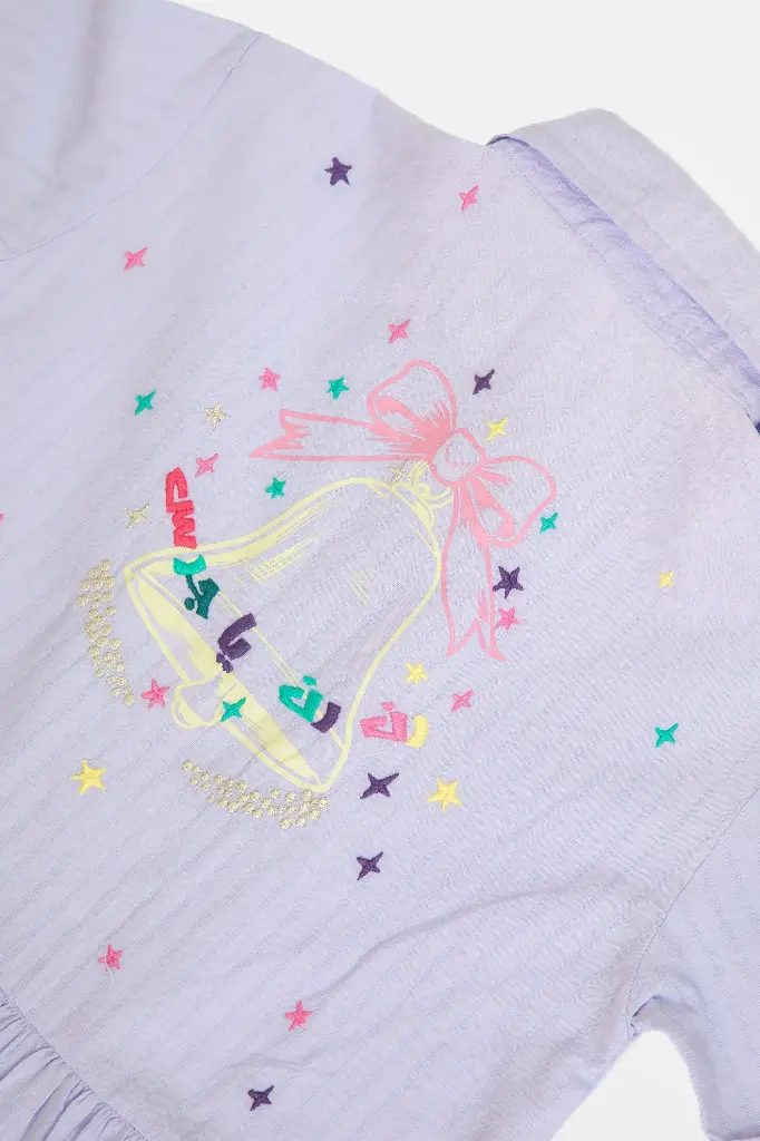 -closeup-embroidered-bell-pink-bow-and-stars-on-purple-dress.webp